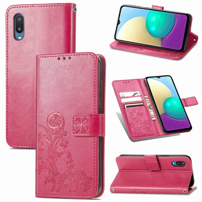 Rose red leather wallet phone case with embossed floral design and front clasp strap.