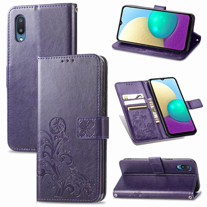 Purple leather wallet phone case with embossed floral pattern and front clasp strap.