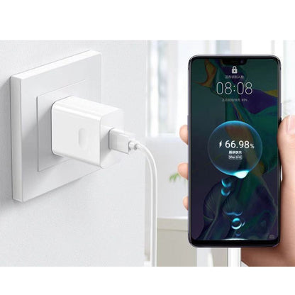 White 66W USB fast-charging travel charger powering a smartphone via USB cable.