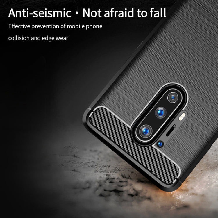 Black TPU phone case with carbon-fiber corner accents and raised camera cutout for OnePlus 8 Pro