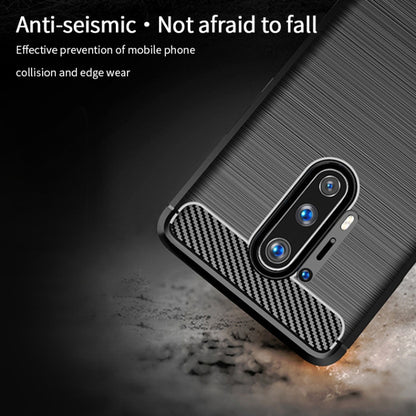 Black TPU phone case with carbon-fiber corner accents and raised camera cutout for OnePlus 8 Pro