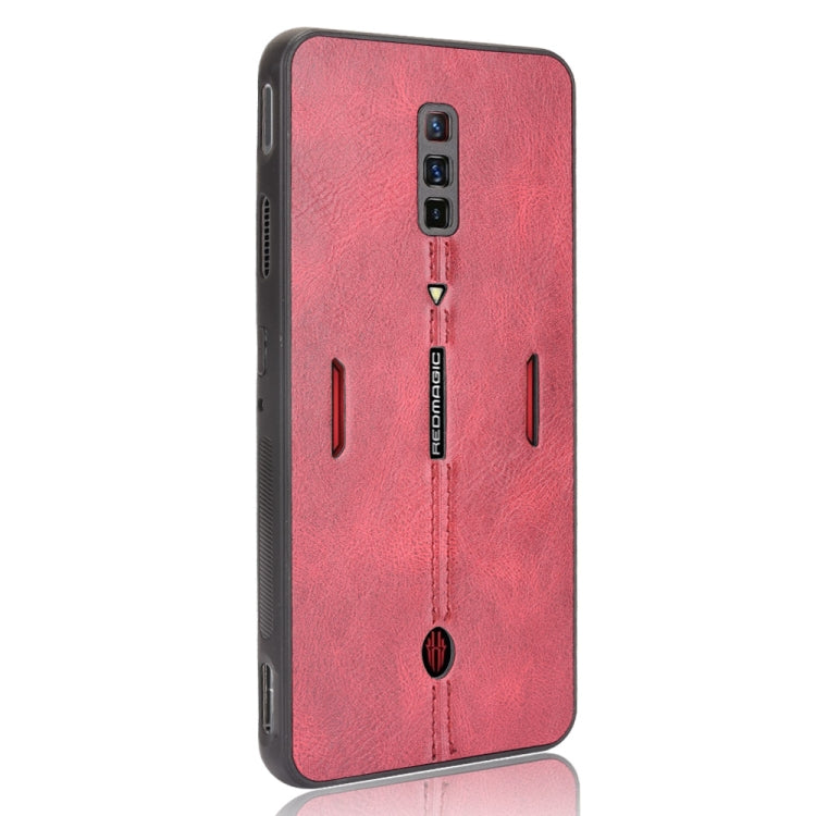 Shockproof phone case with red textured back and black protective edges, side button cutouts