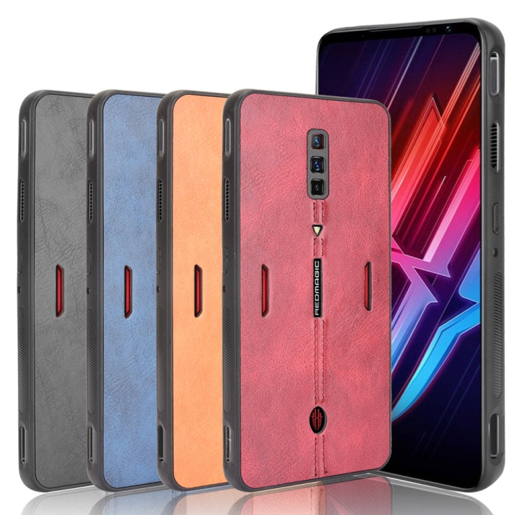 Set of shockproof phone cases in gray, blue, orange, and red with textured backs
