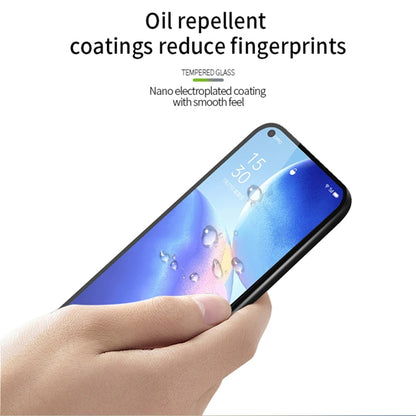 Tempered glass screen protector film with oil-repellent fingerprint-reducing coating