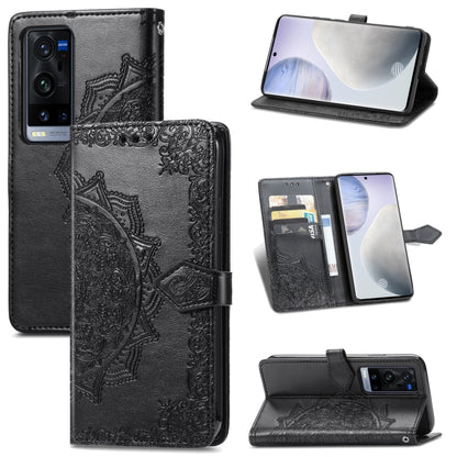 Black mandala-emboss leather flip phone case with card slots and open stand view.