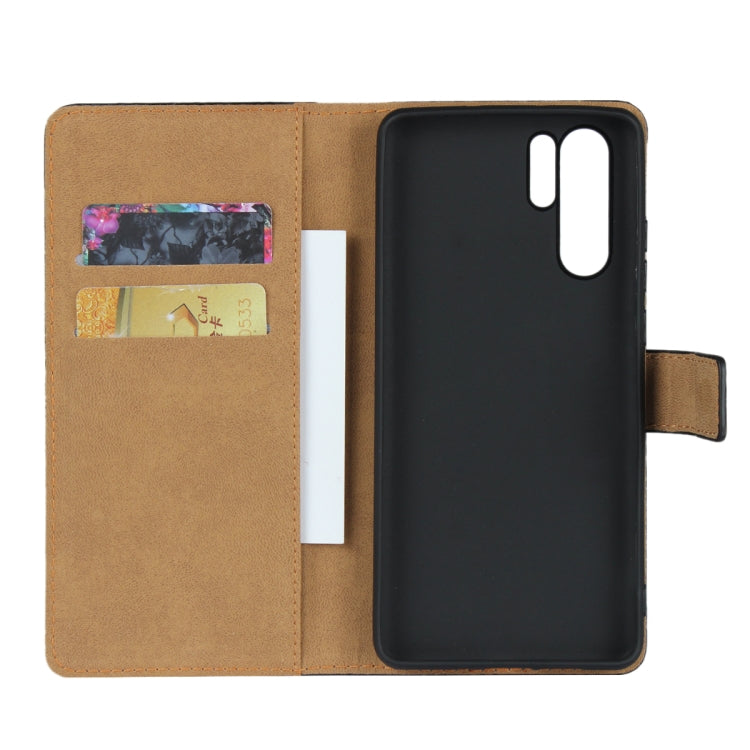 Black leather flip wallet case opened, showing card slots and phone back cutout