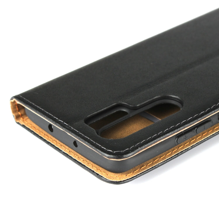 Black leather case bottom close-up with speaker and charging port openings