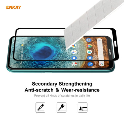 Tempered glass screen protector film covering a smartphone front screen