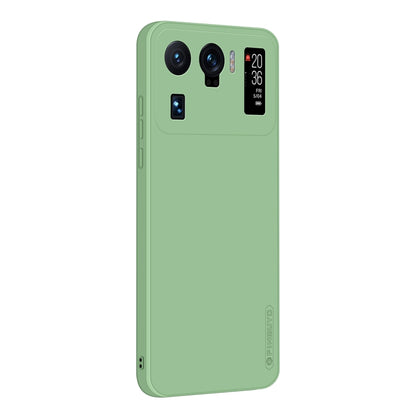 Green phone case with camera cutouts and raised edges for shock protection