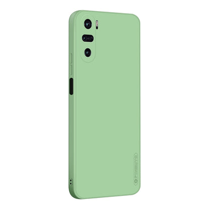 Green liquid silicone TPU phone case with camera cutouts and raised rim protection