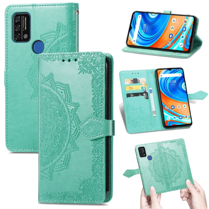 Green embossed mandala flip leather phone case with card slots and side strap