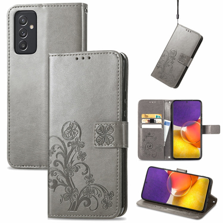 Gray leather wallet phone case with embossed floral pattern, clasp, card slots, lanyard