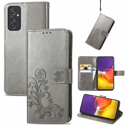 Gray leather wallet phone case with embossed floral pattern, clasp, card slots, lanyard