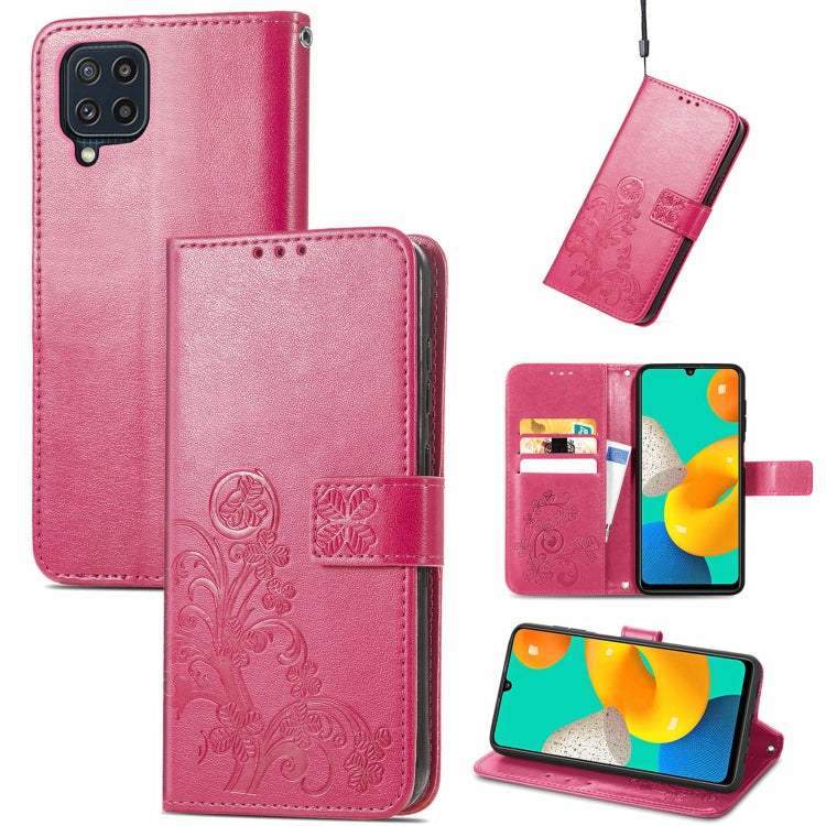 Pink leather wallet phone case with embossed floral pattern, clasp, card slots, lanyard