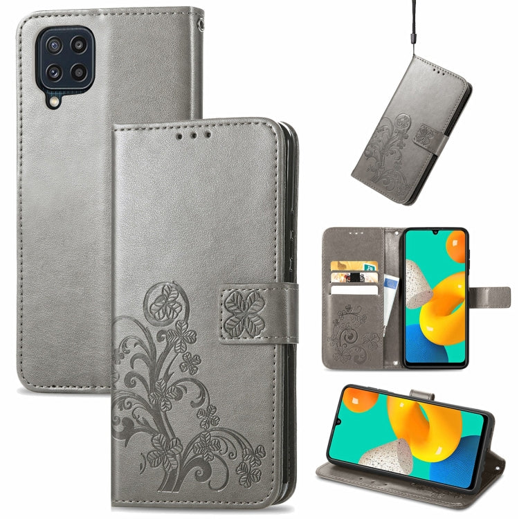 Gray leather wallet phone case with embossed floral pattern, clasp, card slots, lanyard