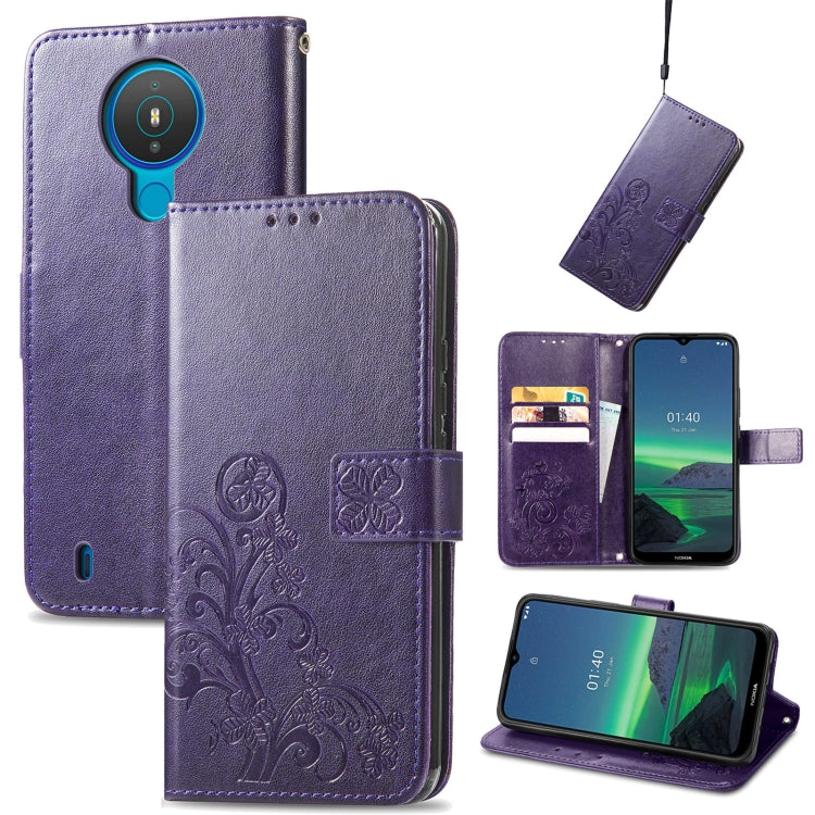 Dark purple embossed leather wallet phone case with lanyard, card slots, and flip stand