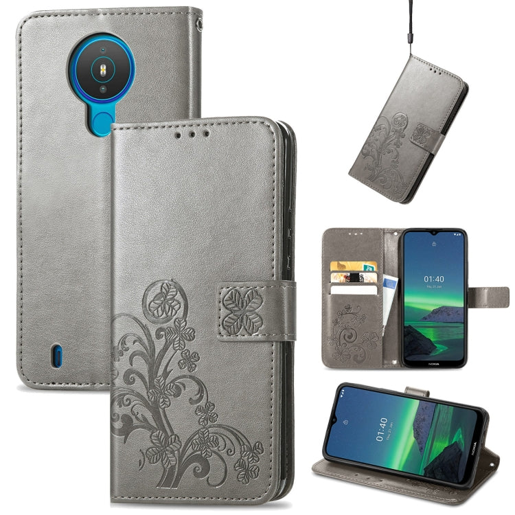 Gray embossed leather wallet phone case with lanyard, card slots, and flip stand