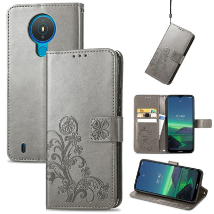 Gray embossed leather wallet phone case with lanyard, card slots, and flip stand