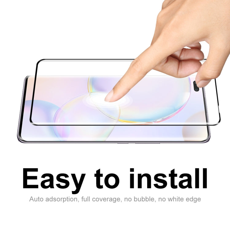 Curved full-coverage tempered glass screen protector being installed on a smartphone screen.