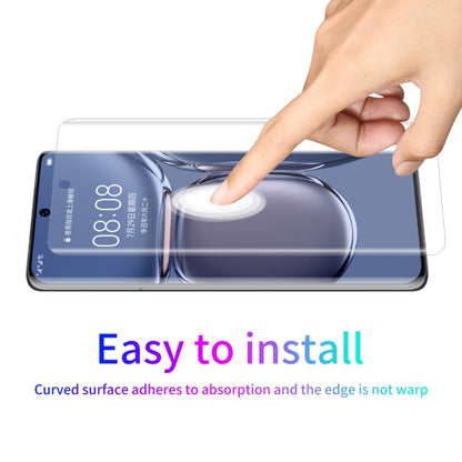 Curved PET screen protector being applied with hand, clear film for smartphone