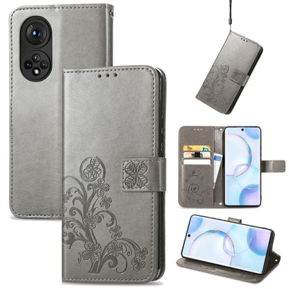 Light gray embossed leather wallet phone case with clasp, lanyard, and card slots