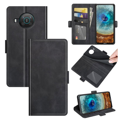 Black flip leather phone case with magnetic buckle, card slots, and wallet holder