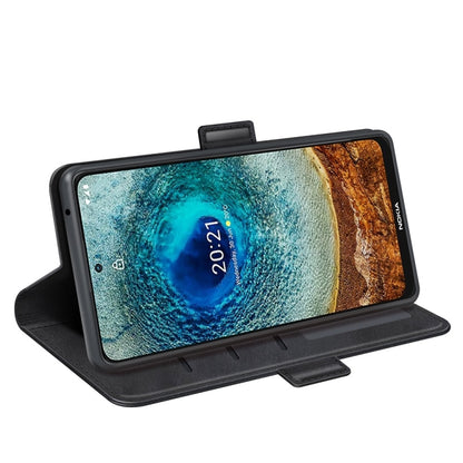Black horizontal flip case propped up for viewing with magnetic strap
