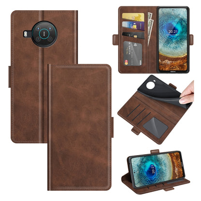Brown wallet flip phone case open with card slots and magnetic clasp