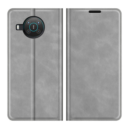 Grey leather phone case with magnetic flap and camera cutout; front and back view