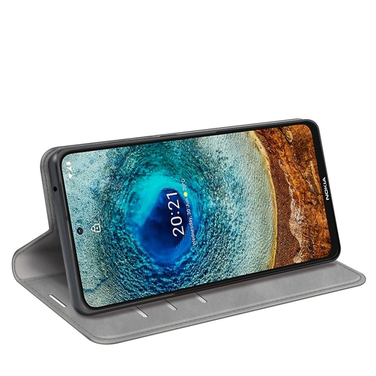 Grey leather wallet phone case with stand for hands-free viewing; phone face shown