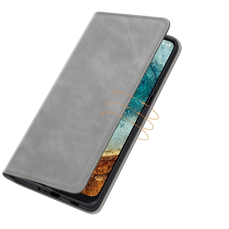 Grey leather phone case with magnetic closure and slim wallet cover; phone side view