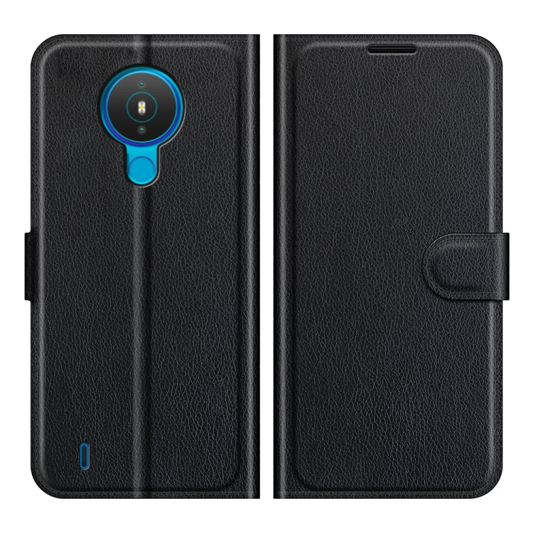 Black textured flip phone case with magnetic closure and cutouts for Nokia 1.4