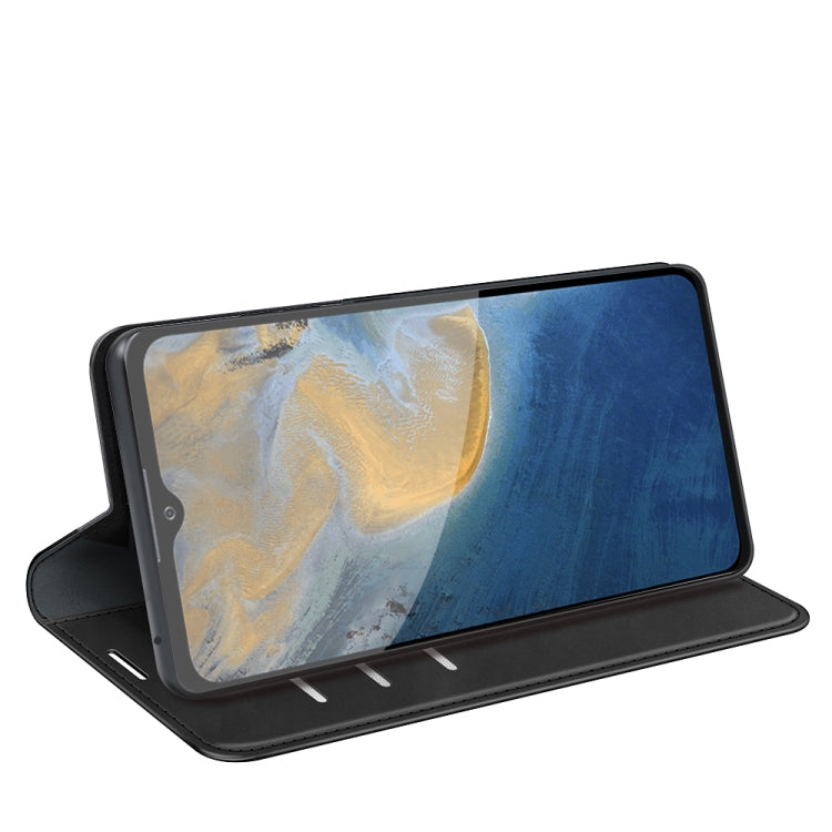 Black leather folio case with flip cover propped up as a viewing stand