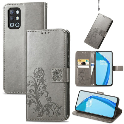 Gray leather phone case with embossed floral clasp, card slots, and lanyard