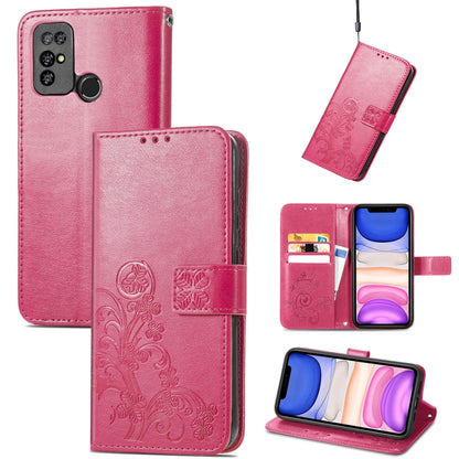 Pink leather phone case with embossed floral clasp, card slots, and lanyard