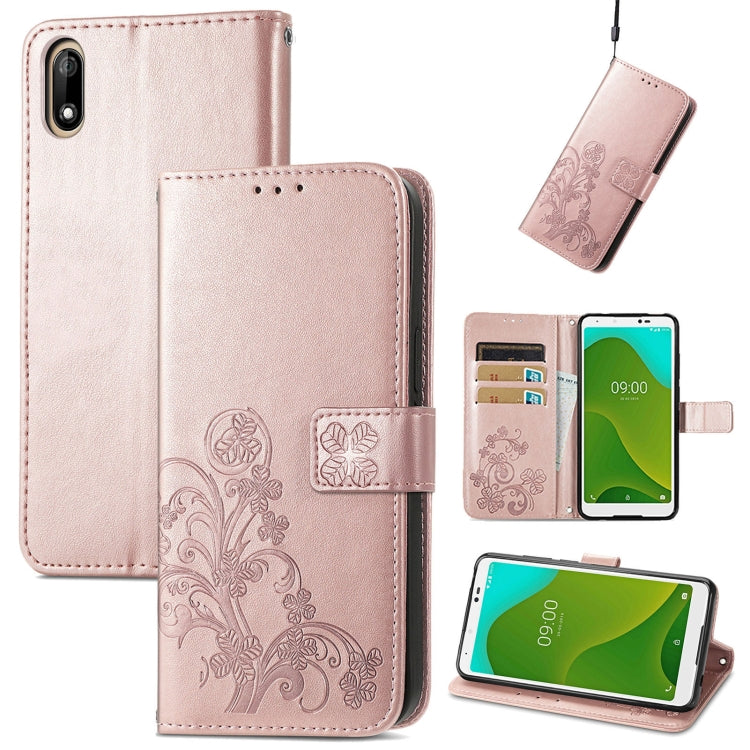 Light pink leather phone case with embossed floral clasp, card slots, and kickstand