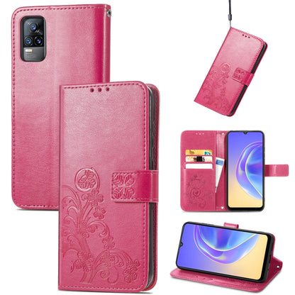 Pink leather wallet phone case with embossed floral, card slots, and lanyard strap