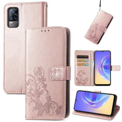 Light pink leather wallet phone case with embossed floral, card slots, and lanyard strap