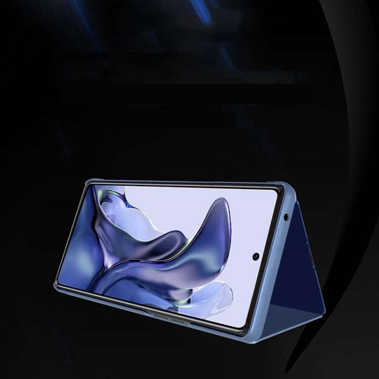 Horizontal flip leather mirror case with stand, blue phone angled for viewing