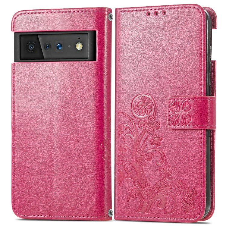 Magenta embossed leather wallet phone case with card holder and four-leaf clasp detail