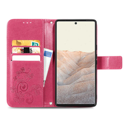 Magenta leather folio phone case with card slot window and four-leaf clasp pattern