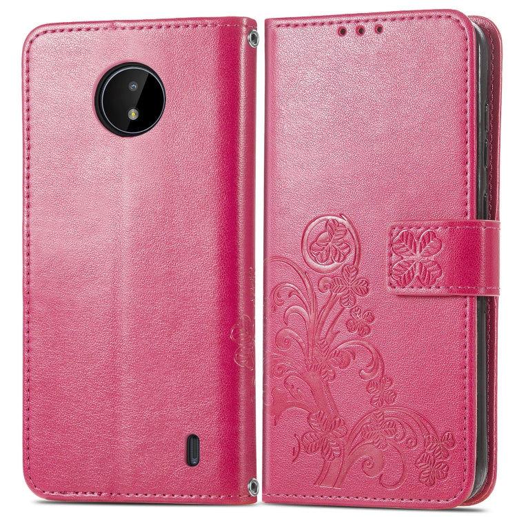 Pink leather wallet phone case with embossed floral pattern, flip cover, card slot