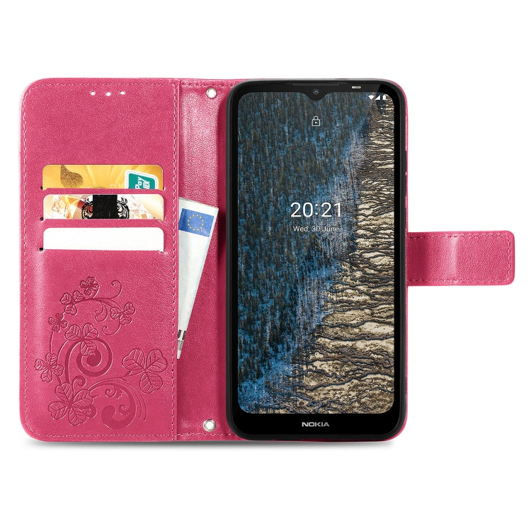 Magenta leather wallet phone case with embossed floral pattern, card slots, flip cover, stand