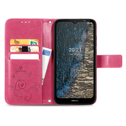 Magenta leather wallet phone case with embossed floral pattern, card slots, flip cover, stand