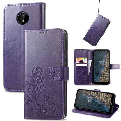 Purple leather wallet phone case with embossed floral pattern, card slots, lanyard, stand