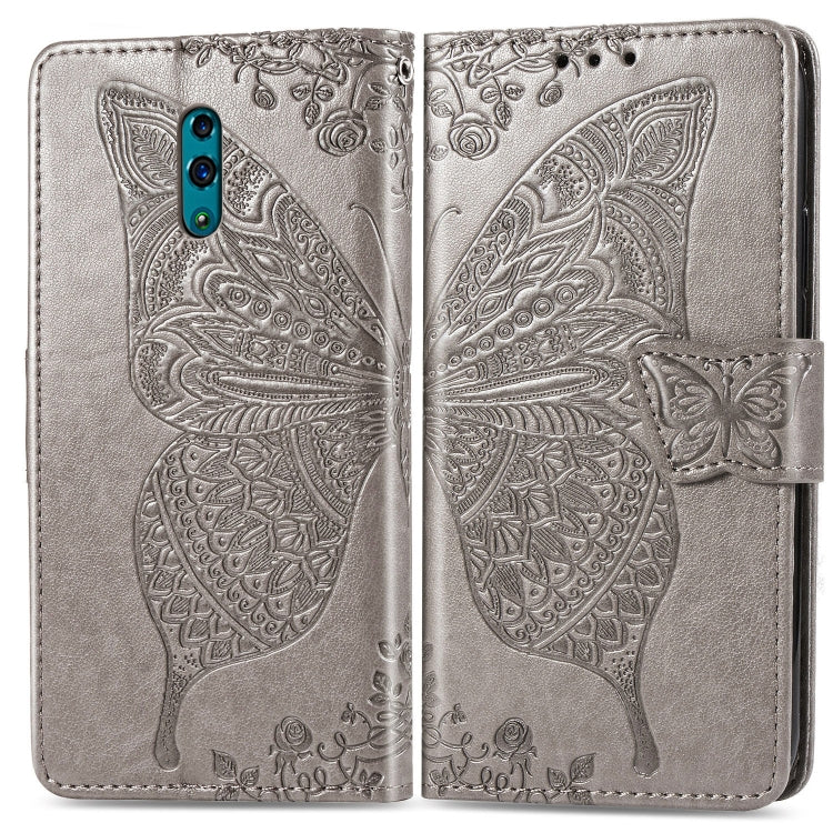 Silver embossed flip phone wallet case with butterfly and floral pattern, folded view