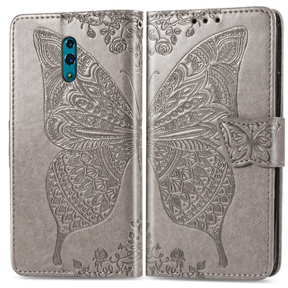 Silver embossed flip phone wallet case with butterfly and floral pattern, folded view