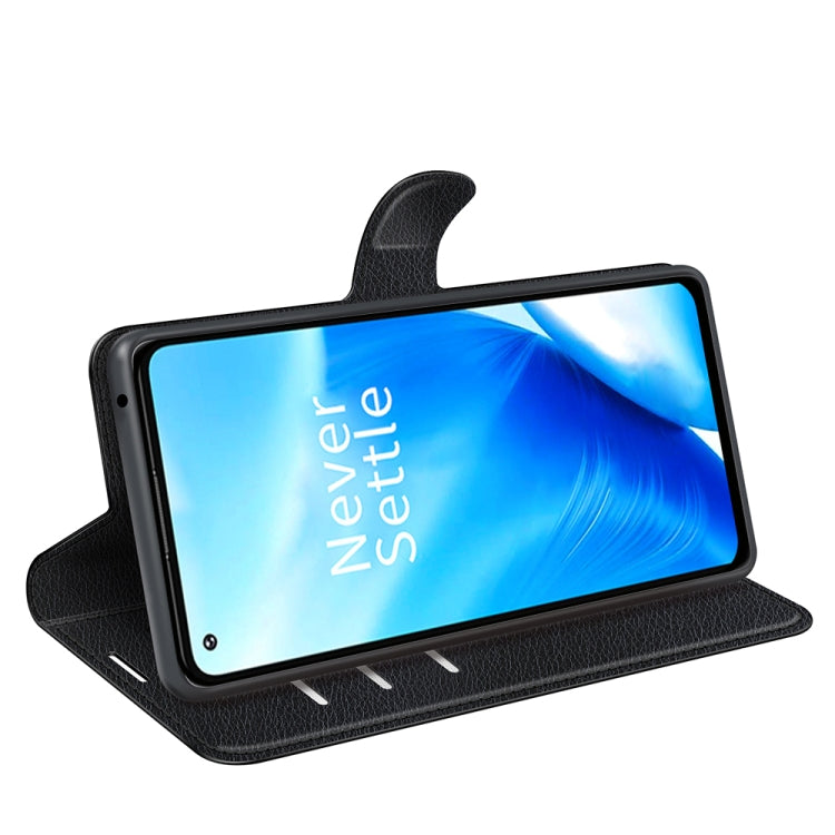 Black litchi texture flip wallet phone case used as a viewing stand