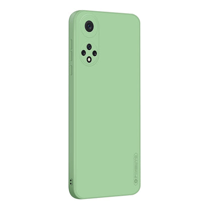 Green liquid silicone TPU phone case, back view with camera lens cutouts and speaker cutout.