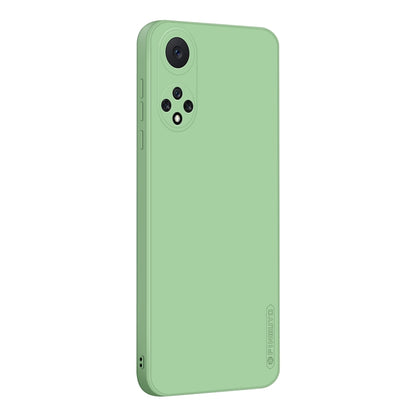 Green liquid silicone TPU phone case, back view with camera lens cutouts and side port openings.